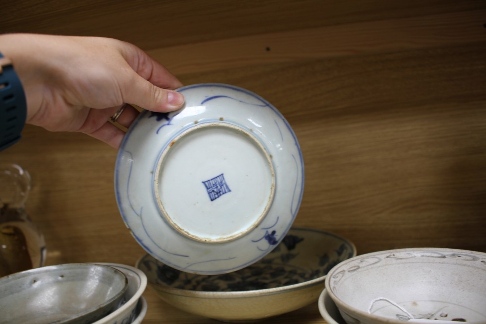 A group of Chinese and Sawankhalok blue and white ceramic bowls and dishes (10)